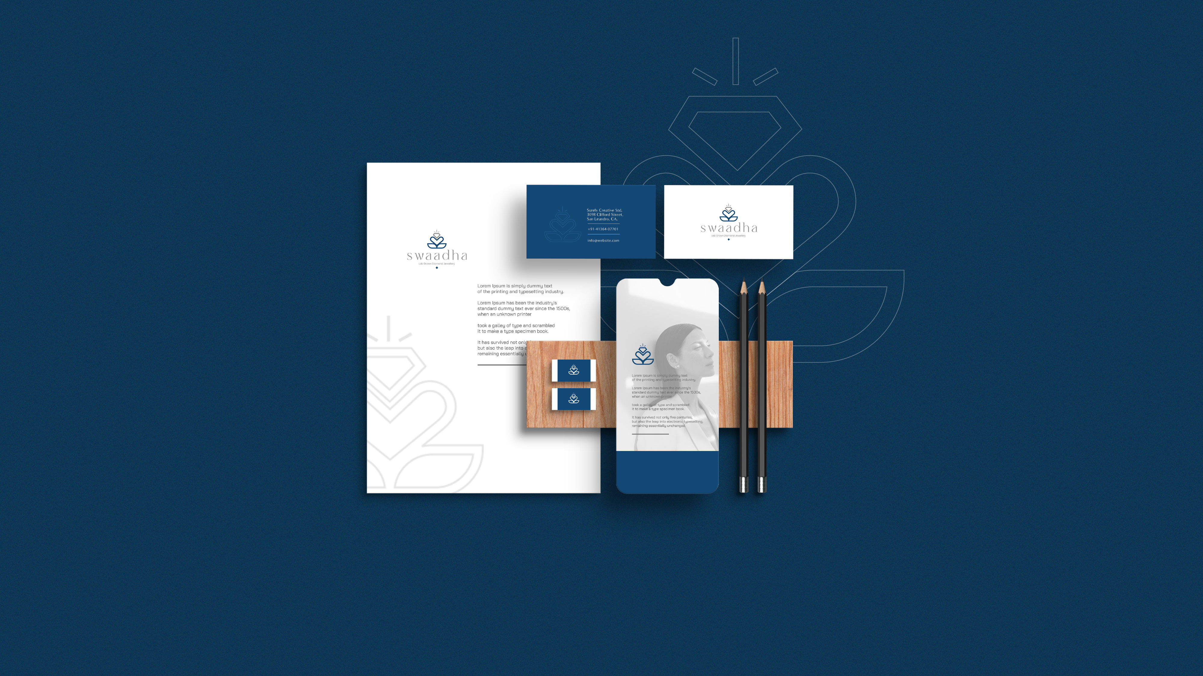 Swaadha stationery flat lay — letterhead, business cards, phone mockup, and pencils on navy